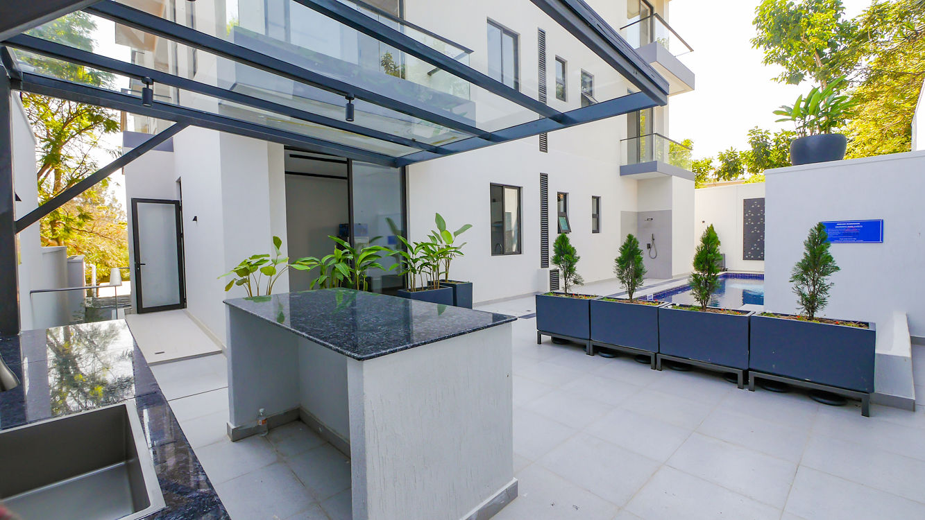 Meraki Residence — courtyard with pool and planters