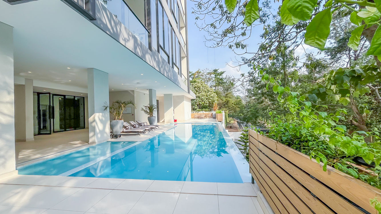 Ohana Residence — poolside walkway and greenery