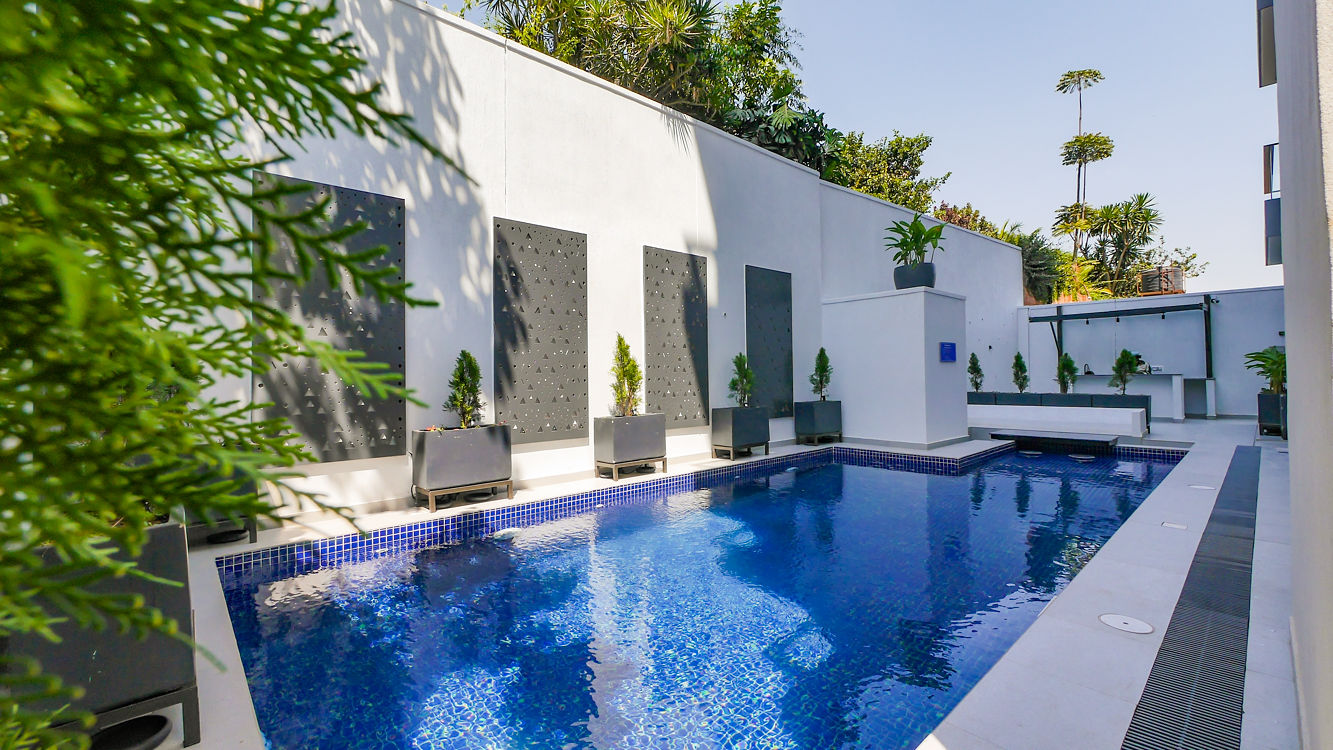 Meraki Residence — pool with decorative wall panels