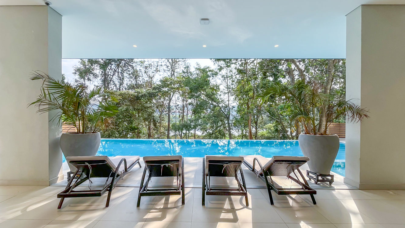 Ohana Residence — pool loungers with garden view